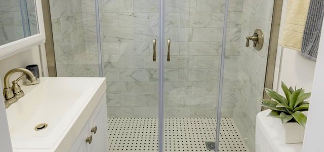 a porcelain sink and shower in a luxury apartment building.