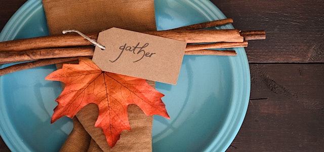 thanksgiving table setting with fall colors and decor.