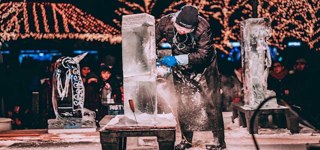 a man sculpting a creation out of ice