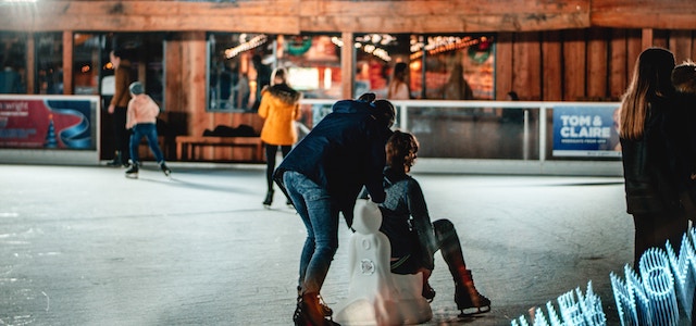 people skating at an outdoor ice rink