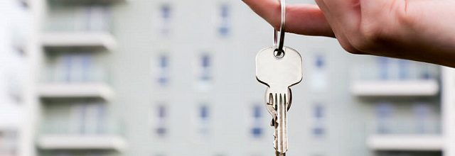 House keys hanging off a person's finger