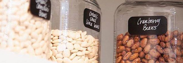 Labeled glass jars on a shelf